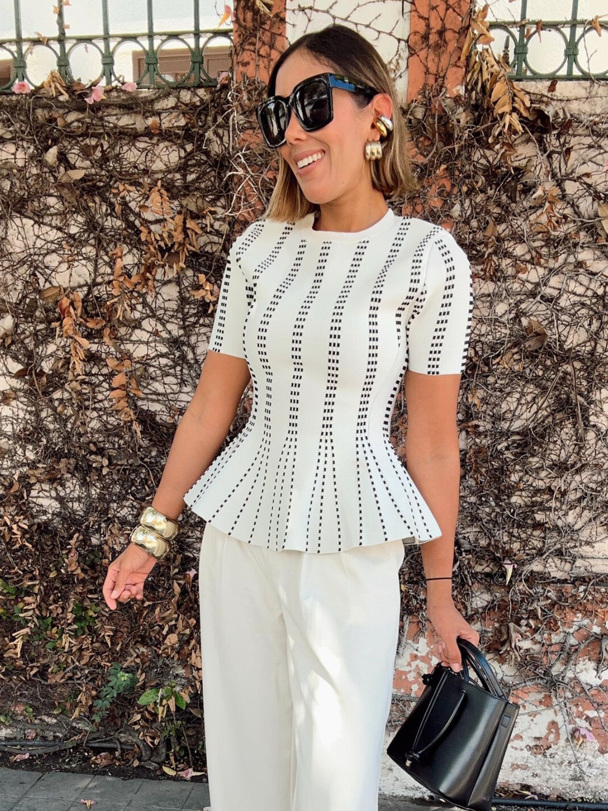 The Metro Lines Peplum Knit Blouse