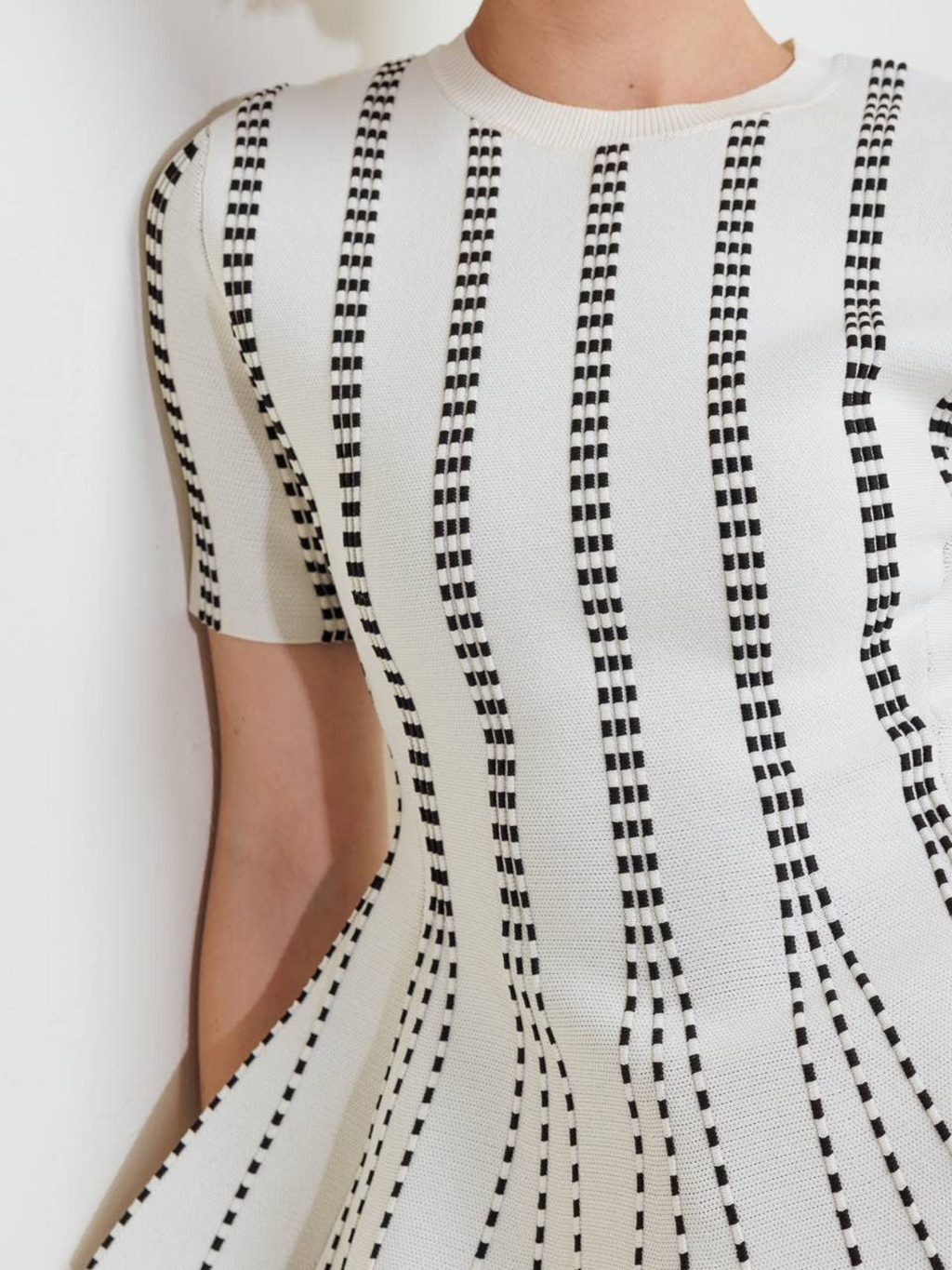 The Metro Lines Peplum Knit Blouse