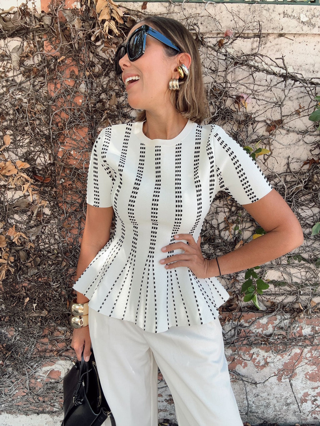 The Metro Lines Peplum Knit Blouse