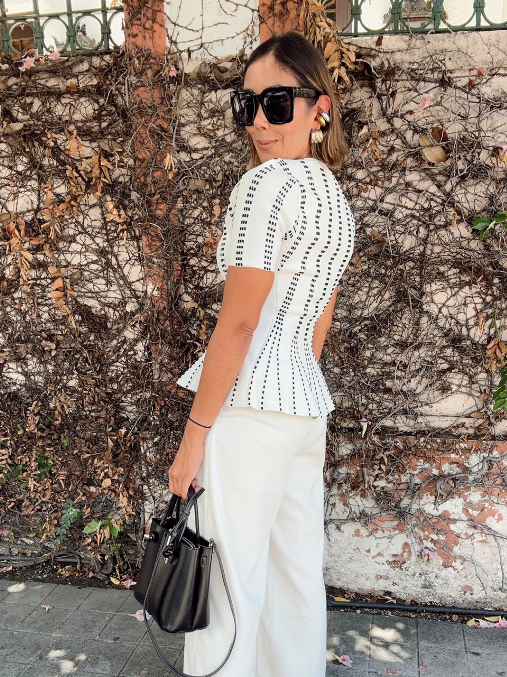 The Metro Lines Peplum Knit Blouse